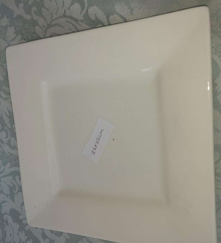 A COLLECTION OF BASIC WHITE PORCELAIN SERVING PLATTERS SOLD AS IS