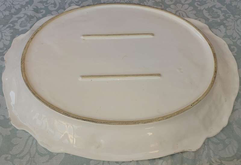 AN EXTRA LARGE PORCELAIN SERVING PLATTER WITH FRUIT DESIGN SOLD AS IS