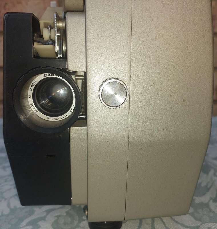AN ANTIQUE MOVIE PROJECTOR WIYHOUT THE POWER CABLE SOLD AS IS NOT TESTED