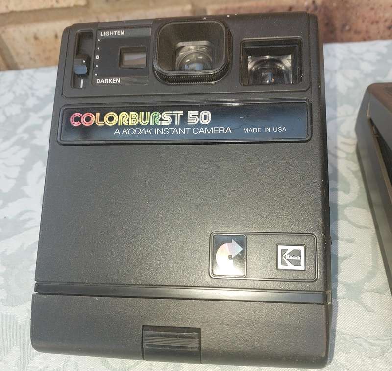 A TWO POLAROID CAMERAS SOLD AS IS