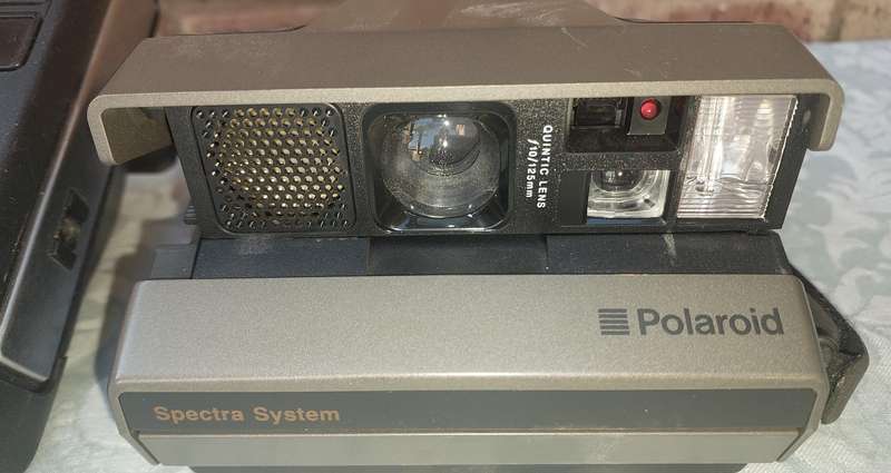 A TWO POLAROID CAMERAS SOLD AS IS