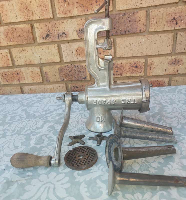 A VINTAGE TRE SPADE 10 MINCER WITH ALL THE COMPONENTS FOR SAUSAGE MAKING SOLD AS IS