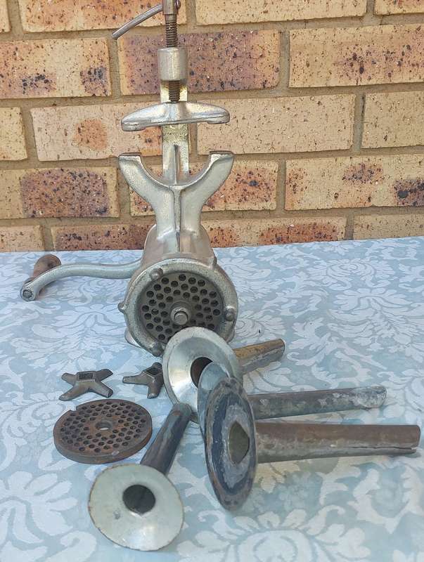 A VINTAGE TRE SPADE 10 MINCER WITH ALL THE COMPONENTS FOR SAUSAGE MAKING SOLD AS IS