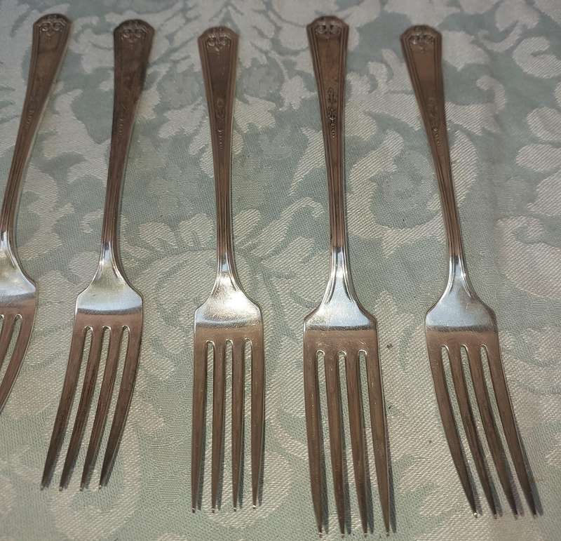 A VINTAGE SET OF STAINLESS STEEL CUTLERY SOLD AS IS