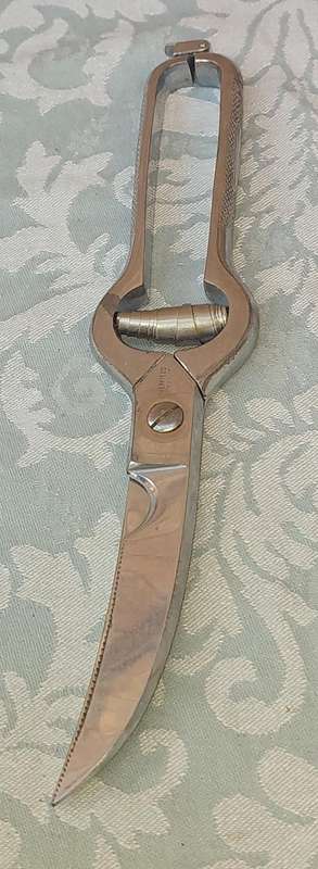 A STAINLESS STEEL CHICKEN CUTTERS SOLD AS IS