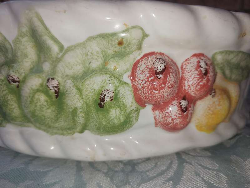 A PORCELAIN FRUIT BOWL SOLD AS IS
