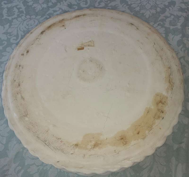 A PORCELAIN FRUIT BOWL SOLD AS IS