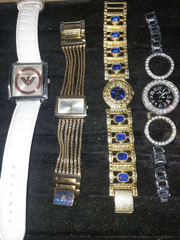 A COLLECTION OF FAMOUS BRANDED FASHION WATCHES SOLD AS IS