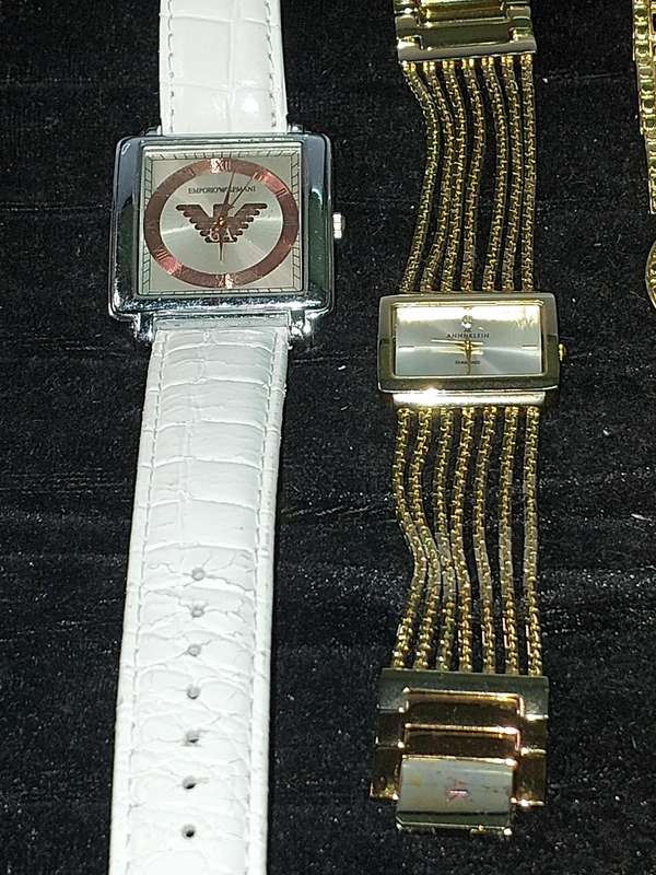 A COLLECTION OF FAMOUS BRANDED FASHION WATCHES SOLD AS IS