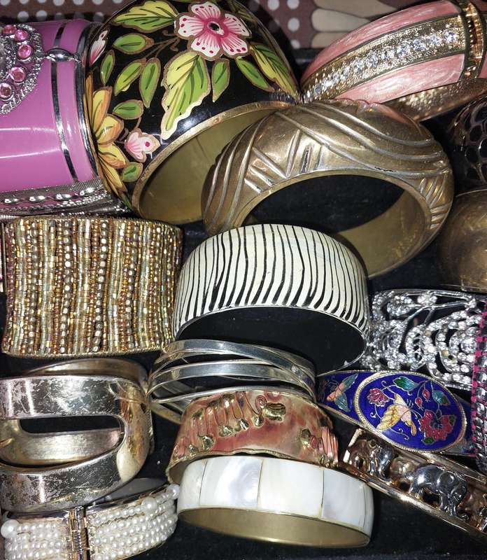 A VINTAGE COLLECTION OF BRACELETS SOLD AS IS