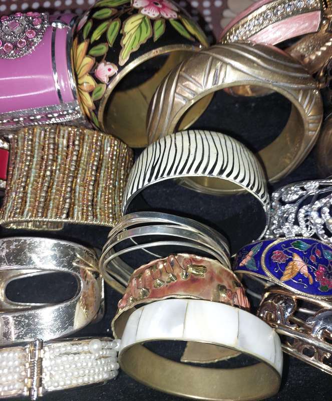 A VINTAGE COLLECTION OF BRACELETS SOLD AS IS