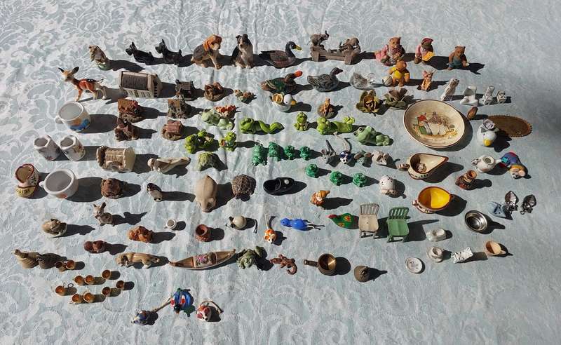 AN ENTIRE COLLECTION PORCELAIN CHARMS AND FIGURINES SOLD AS IS