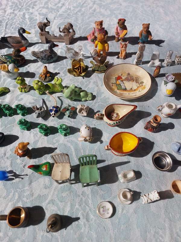 AN ENTIRE COLLECTION PORCELAIN CHARMS AND FIGURINES SOLD AS IS