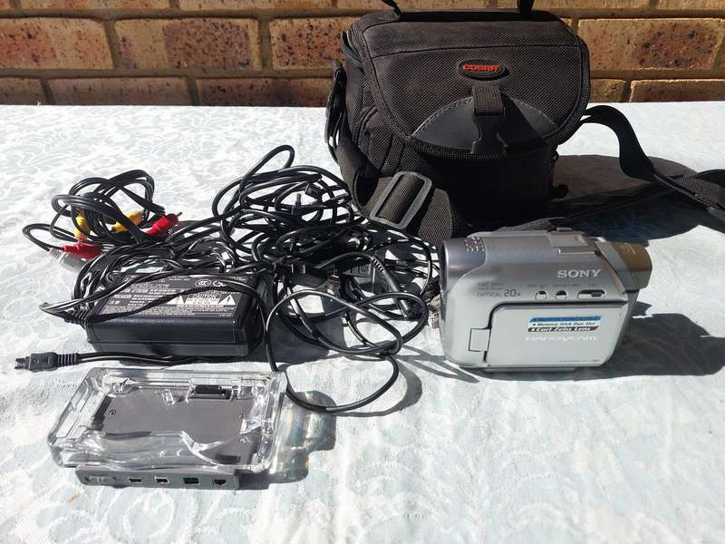 A SONY MODEL DCR-HC32E DIGITAL VIDEO CAMERA RECORDER IN WORKING ORDER WITH ALL CABLES , BATTERY AND