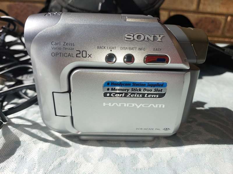 A SONY MODEL DCR-HC32E DIGITAL VIDEO CAMERA RECORDER IN WORKING ORDER WITH ALL CABLES , BATTERY AND