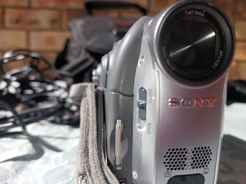 A SONY MODEL DCR-HC32E DIGITAL VIDEO CAMERA RECORDER IN WORKING ORDER WITH ALL CABLES , BATTERY AND