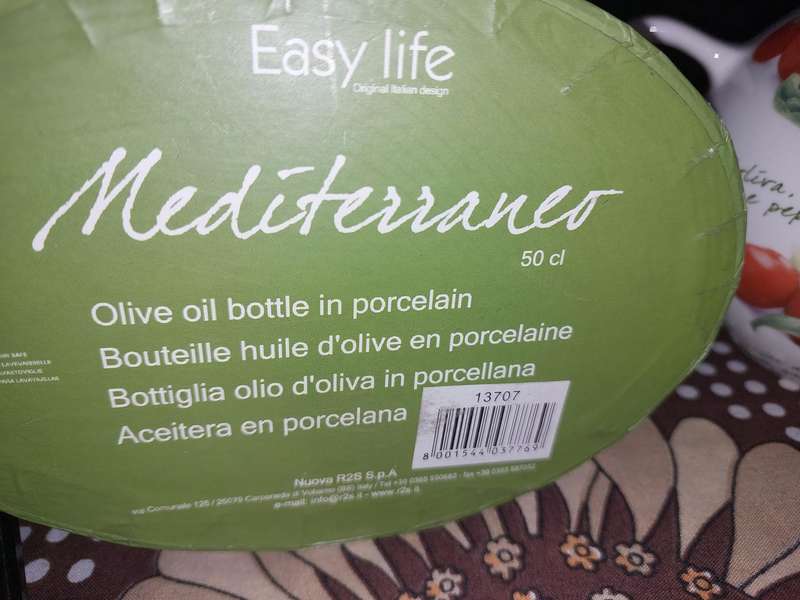 A COLLECTORS MEDITERRANEO OLVE OIL BOTTLE WITH A CORK LID SOLD AS IS