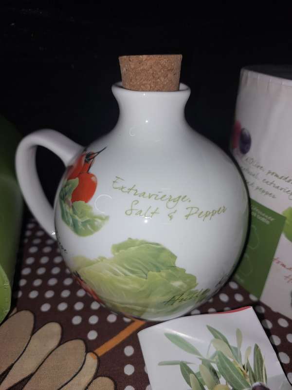 A COLLECTORS MEDITERRANEO OLVE OIL BOTTLE WITH A CORK LID SOLD AS IS