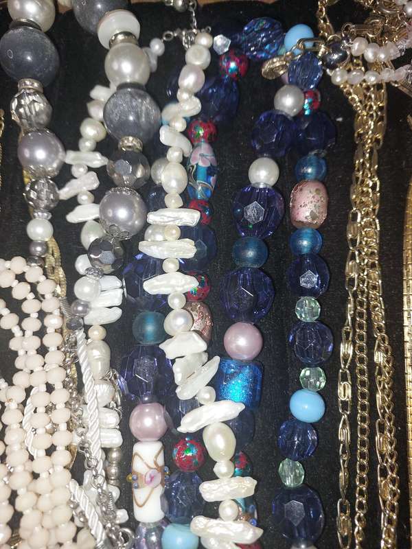 A VINTAGE COLLECTION OF COSTUME NECKLACES SOLD AS IS