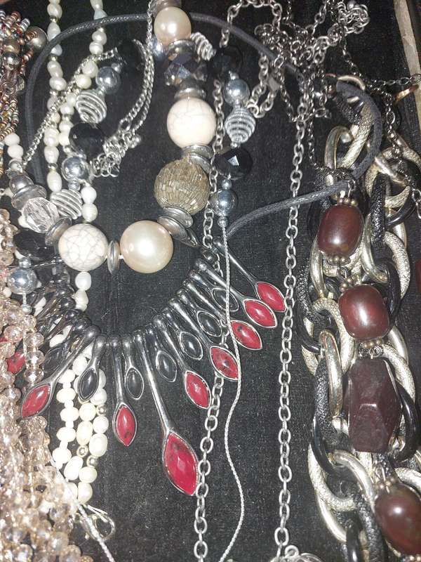 A COLLECTION OF COSTUME NECKLACES SOLD AS IS