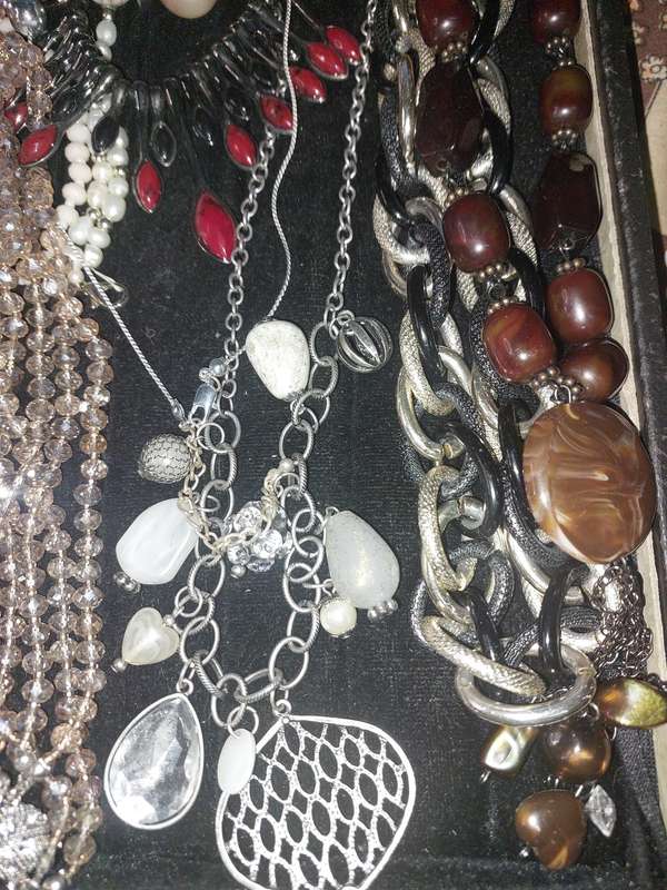 A COLLECTION OF COSTUME NECKLACES SOLD AS IS