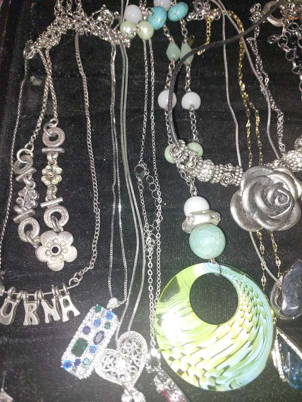 A COLLECTION OF DESIGNER COSTUME NECKLACES SOLD AS IS