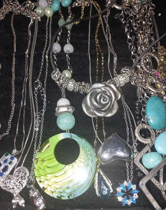 A COLLECTION OF DESIGNER COSTUME NECKLACES SOLD AS IS