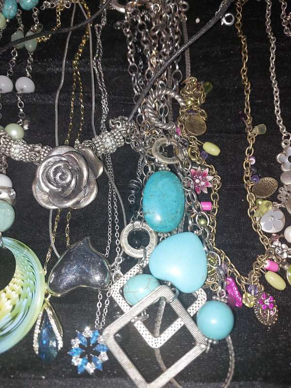 A COLLECTION OF DESIGNER COSTUME NECKLACES SOLD AS IS