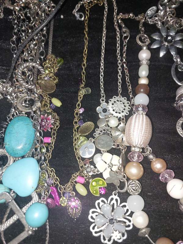 A COLLECTION OF DESIGNER COSTUME NECKLACES SOLD AS IS