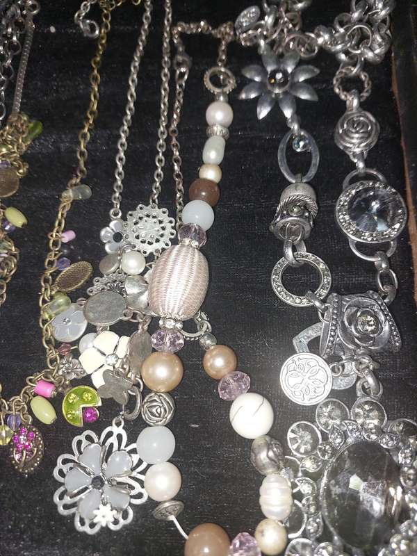 A COLLECTION OF DESIGNER COSTUME NECKLACES SOLD AS IS