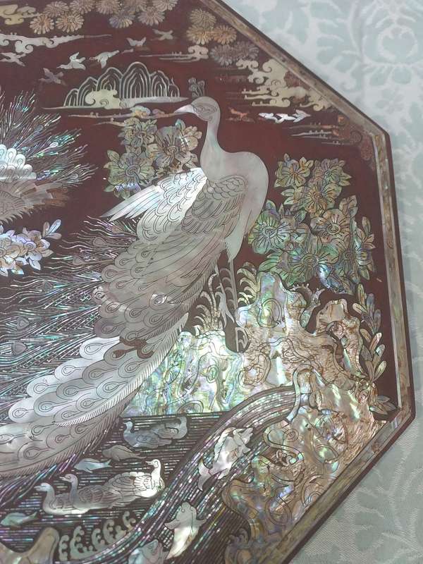 A LACQUER WOODEN JEWELRY BOX WITH WOODEN INSERTS AND A MOTHER PEARL INLAY OF PEACOCKS AND FLORAL IN