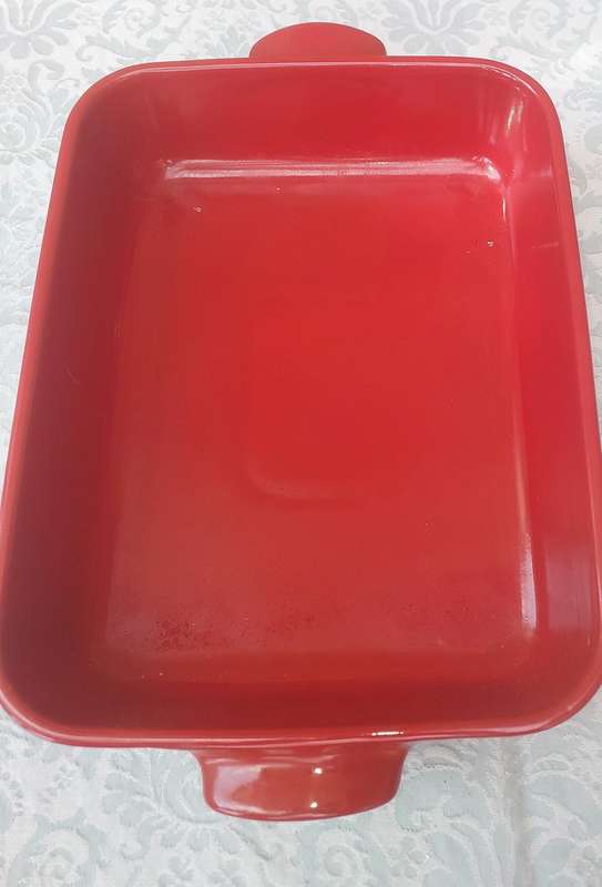 A EMILE HENRY RED CASSEROLE DISH MADE IN FRANCE SOLD AS IS