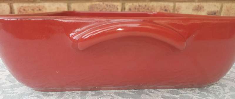A EMILE HENRY RED CASSEROLE DISH MADE IN FRANCE SOLD AS IS