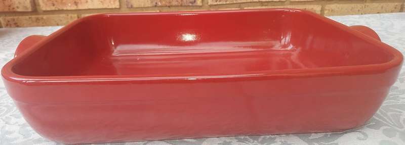 A EMILE HENRY RED CASSEROLE DISH MADE IN FRANCE SOLD AS IS