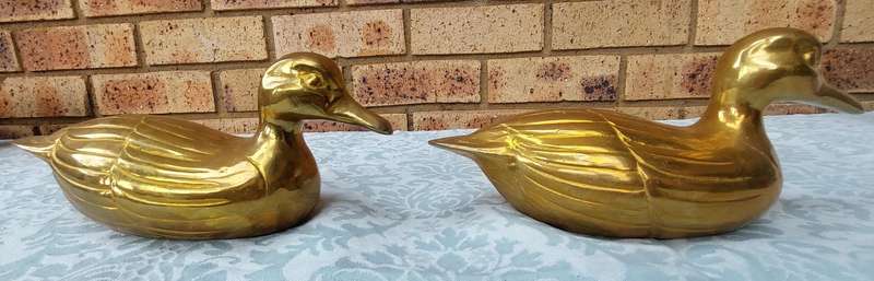 TWO SOLID BRASS DUCKS  SOLD AS IS