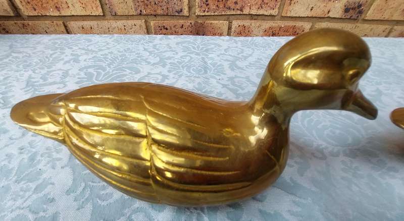 TWO SOLID BRASS DUCKS  SOLD AS IS