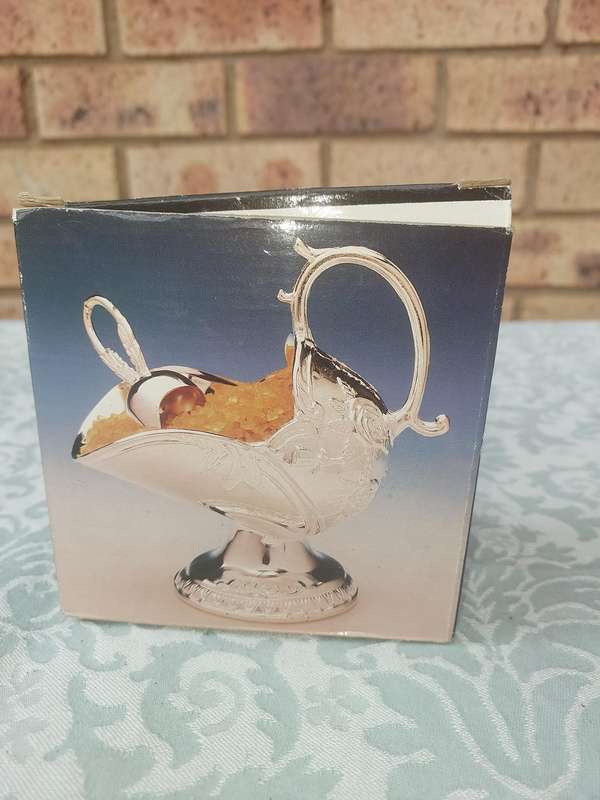 A sugar scuttle never used sold as is