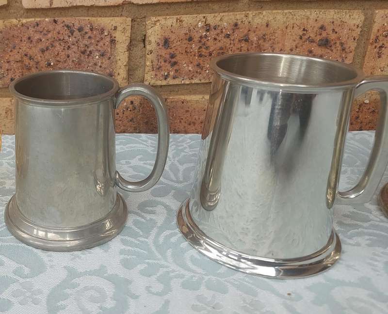 A COLLECTION OF BEER MUGS SOLD AS IS