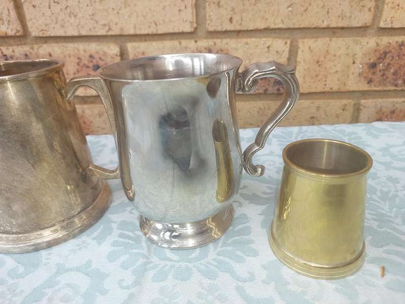 A COLLECTION OF BEER MUGS SOLD AS IS