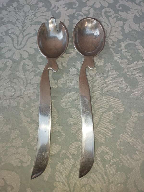 A PAIR OF PEWTEL ART DECOR HAND MADE IN INDIA SALAD LADLES SOLD AS IS