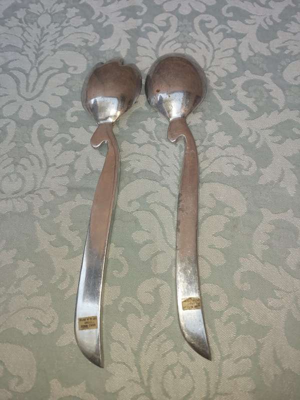 A PAIR OF PEWTEL ART DECOR HAND MADE IN INDIA SALAD LADLES SOLD AS IS