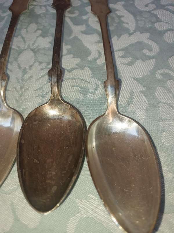 A SET OF 6 CHINA SILVER PLATE TABLE SPOONS SOLD AS IS