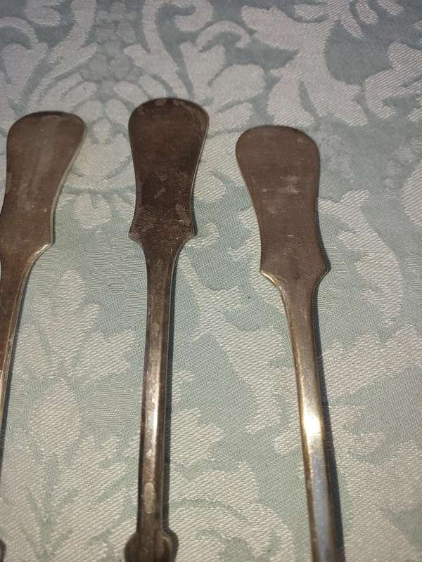 A SET OF 6 CHINA SILVER PLATE TABLE SPOONS SOLD AS IS
