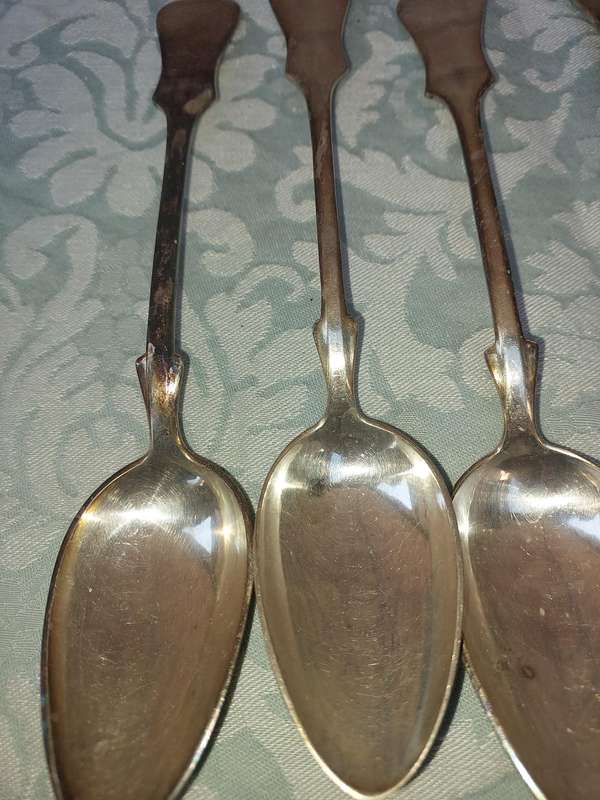 A SET OF 6 CHINA SILVER PLATE TABLE SPOONS SOLD AS IS