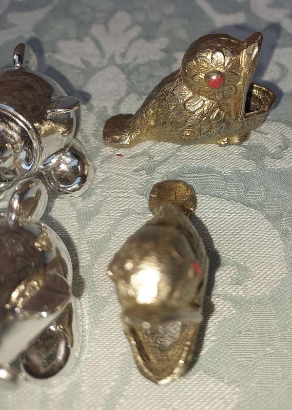 A COLLECTION OF MINIATURE SALT AND PEPPER SHAKERS SOLD AS IS