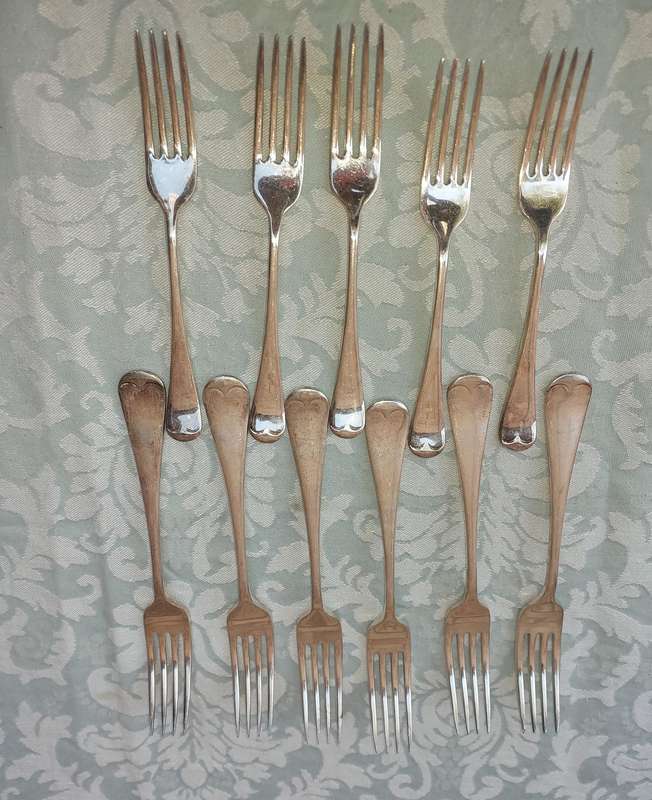 A VINTAGE SET OF 11 EPNS A1 FORKS SOLD AS IS