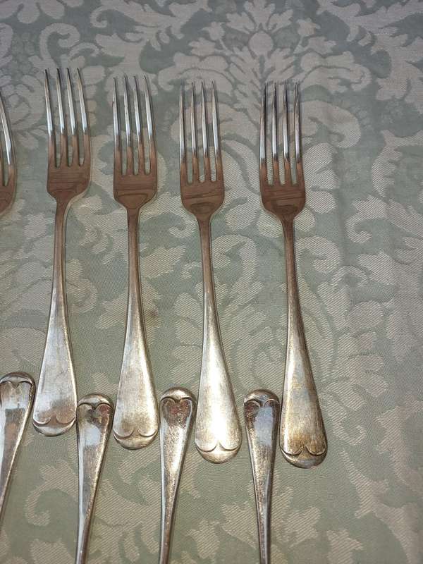 A VINTAGE SET OF 11 EPNS A1 FORKS SOLD AS IS