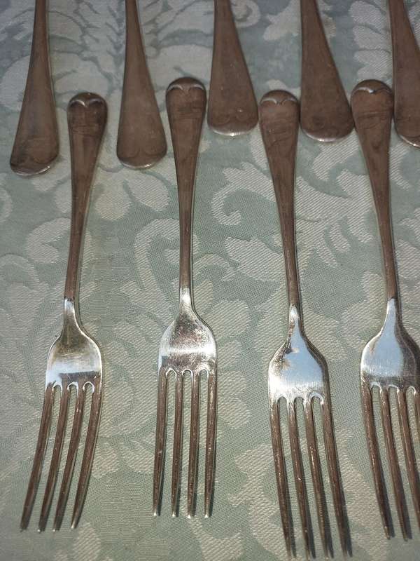 A VINTAGE SET OF 11 EPNS A1 FORKS SOLD AS IS