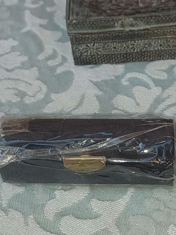 A COLLECTION OF JEWELRY BOXES AND LIPSTCK HOLDERS FOR THE DISCERNING LADY SOLD AS IS