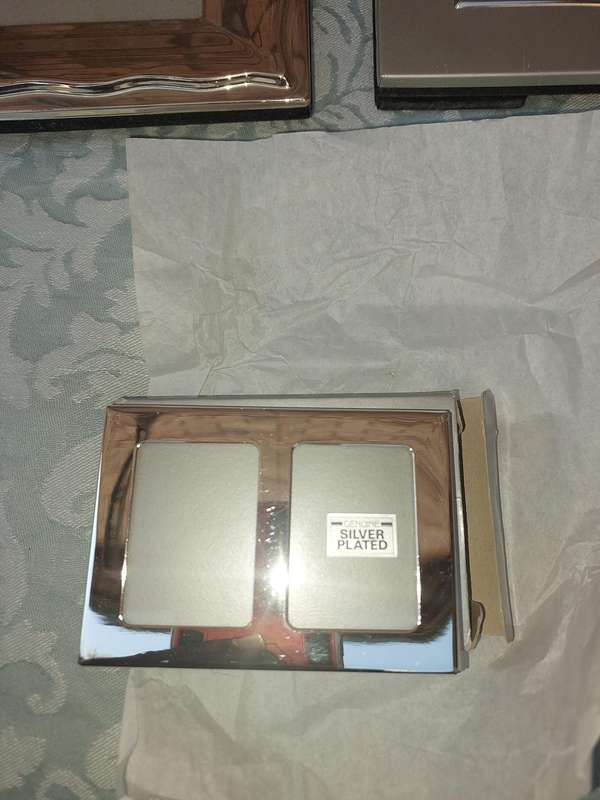 A COLLECTION OF PHOTO FRAMES SOLD AS IS